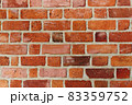 Textured red brick wall background or backdrop, rectangular red terracotta bricks laid out as pattern, architectural structure for old rough building 83359752