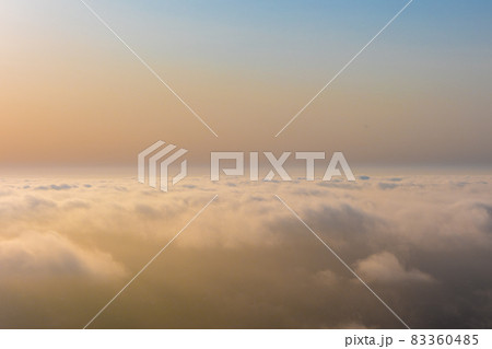 Aerial sunset view over the cloud facing the sun. 83360485