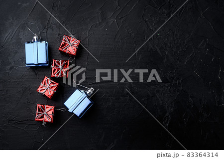 Christmas tree decoration, top view flat lay, on black dark stone table background, with copy space for text 83364314