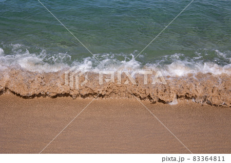 Close up of small wave on sand in tropical beach 83364811
