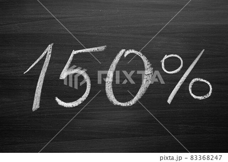 150 percent header written with a chalk on the blackboard 83368247