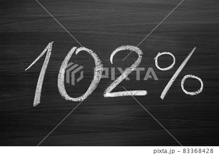 102 percent header written with a chalk on the blackboard 83368428