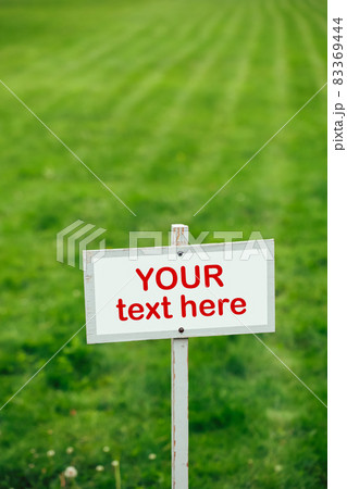 your text here sign against green lawn background your text here sign against green lawn background 83369444
