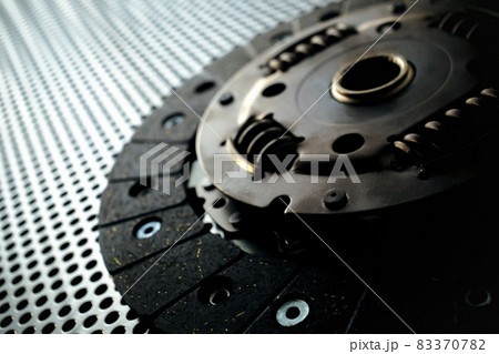 Car clutch on a metal surface 83370782