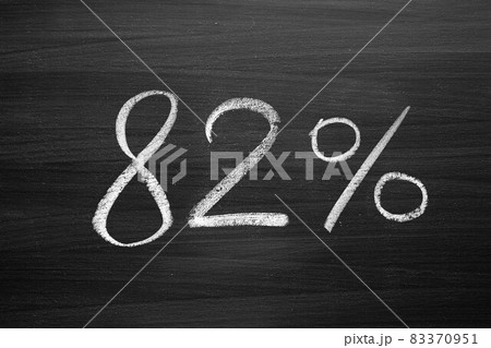 82 percent header written with a chalk on the blackboard 83370951