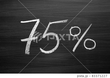 75 percent header written with a chalk on the blackboard 75 percent header written with a chalk on the blackboard 83371227
