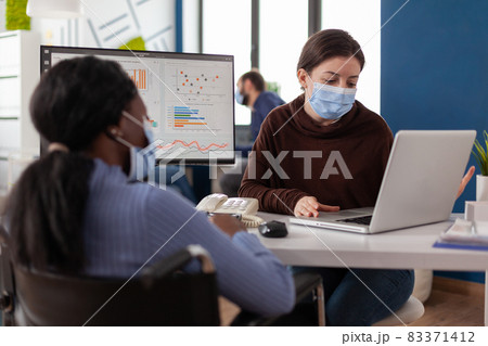 Multiethnic business team with medical face masks to prevent infection with coronavirus 83371412