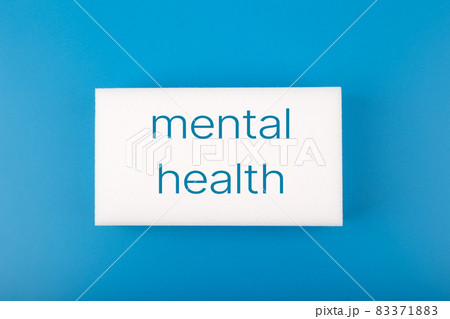 Mental health text written on white rectangle in the middle of dark blue background 83371883