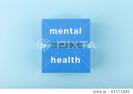 Mental health text written on dark blue rectangles in the middle of bright blue background Mental health text written on dark blue rectangles in the middle of bright blue background 83371885