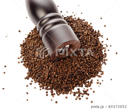 pepper mill on peppercorns heap, isolated on white 83372052