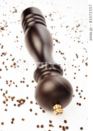 pepper mill and peppercorns, isolated on white 83372357