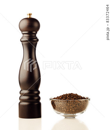 pepper mill and peppercorns, isolated on white 83372464