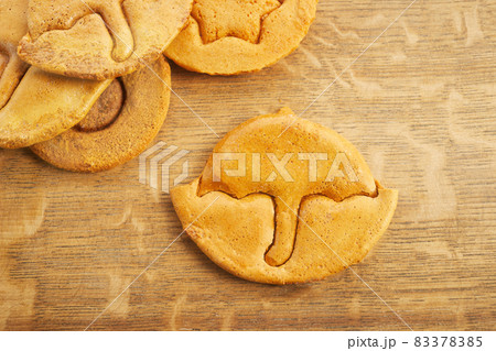 Korean Dalgona honeycomb sugar cookie with umbrella shape to play new trend candy challenge 83378385