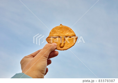 Korean Dalgona honeycomb sugar cookie with umbrella shape to play new trend candy challenge Korean Dalgona honeycomb sugar cookie with umbrella shape to play new trend candy challenge 83378387