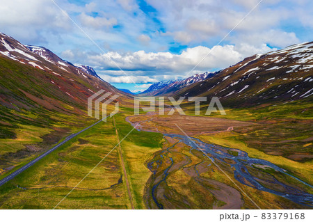 Aerial view of a road going through icelandic landscape Aerial view of a road going through icelandic landscape 83379168
