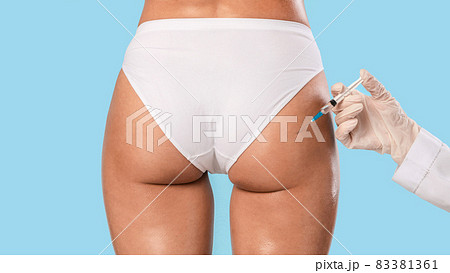 Woman having butt lifting treatment at beauty salon Woman having butt lifting treatment at beauty salon 83381361