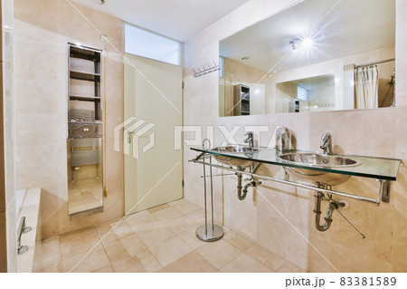 Elegant bathroom design in luxury residential building Elegant bathroom design in luxury residential building 83381589