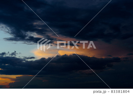 beautiful sunset sky, bright sunlight and silhouette of clouds as a background beautiful sunset sky, bright sunlight and silhouette of clouds as a background 83381804