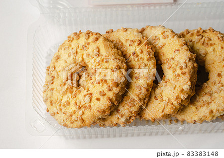 Close-up of Peanut Biscuit Rings in a transparent plastic box. C Close-up of Peanut Biscuit Rings in a transparent plastic box. C 83383148
