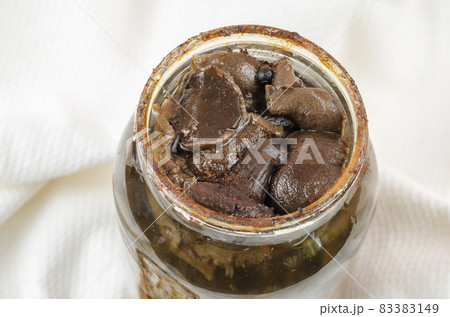Botulism, food poisoning from canned foods concept. Opened Glass Botulism, food poisoning from canned foods concept. Opened Glass 83383149