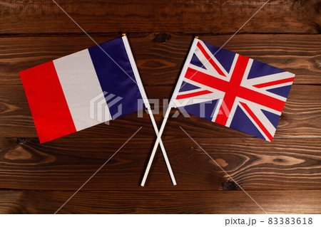 Flag of France and flag of Australia crossed with each other. The image illustrates the relationship between countries. Photography for video news on TV and articles on the Internet and media. Flag of France and flag of Australia crossed with each other. The image illustrates the relationship between countries. Photography for video news on TV and articles on the Internet and media. 83383618