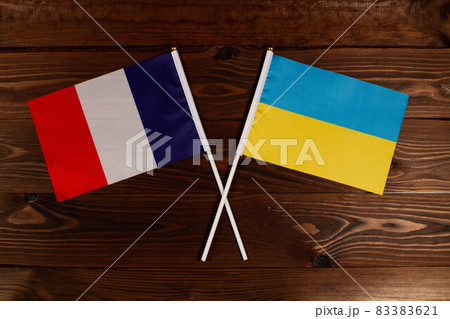Flag of France and flag of Ukraine crossed with each other. The image illustrates the relationship between countries. Photography for video news on TV and articles on the Internet and media. Flag of France and flag of Ukraine crossed with each other. The image illustrates the relationship between countries. Photography for video news on TV and articles on the Internet and media. 83383621