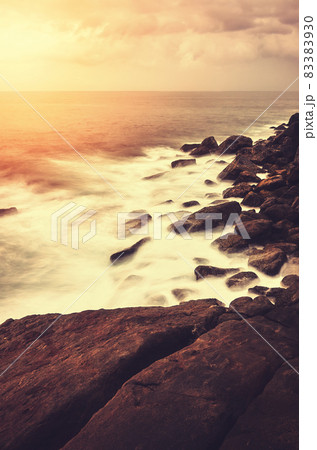 Rocky beach at sunset, color toning applied, Sri Lanka. Rocky beach at sunset, color toning applied, Sri Lanka. 83383930