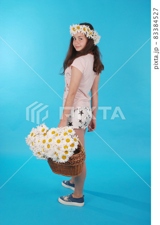 Beautiful girl with chamomile wreath 83384527