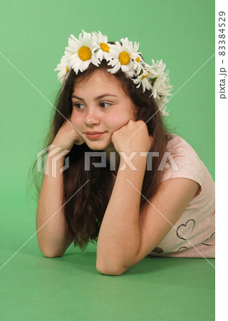 Beautiful girl with chamomile wreath 83384529