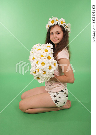 Beautiful girl with chamomile wreath Beautiful girl with chamomile wreath 83384538