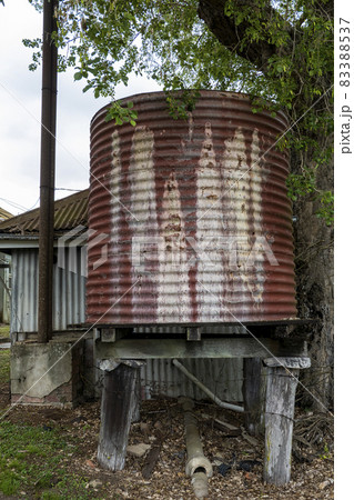 Old Iron Tank Stand On Wooden Posts 83388537