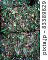 Bundle of pressed plastic bottles prepared for a garbage recycling on waste recycling plant. Camera moves forward. Pollution problem. Stabilized video 83389629