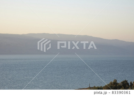 Sunrise over the Dead Sea on a foggy day. A view from Israel To Jordan Mountains. 83390361