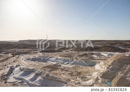 Beautiful lunar landscape. Wight and smooth hills in various shapes in a desert landscape. The whitish, rounded, winding, and smooth chalk rocks. Israel. 83392829