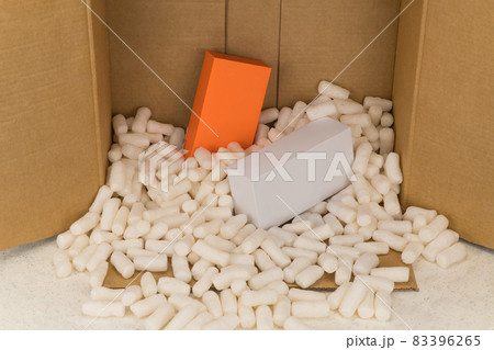Cardboard box with styrofoam filler for safe packaging. Gift package Cardboard box with styrofoam filler for safe packaging. Gift package 83396265