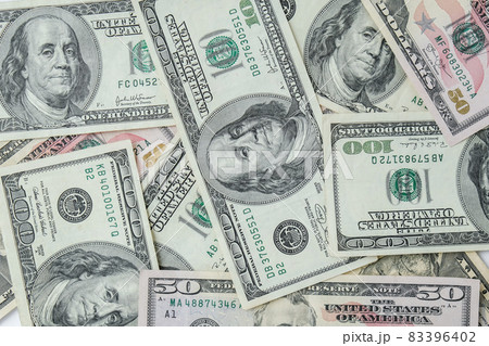Us dollar bills are creative layout. Business concept, development perspective. Flat lay. Top view. Minimal creative style pattern Us dollar bills are creative layout. Business concept, development perspective. Flat lay. Top view. Minimal creative style pattern 83396402