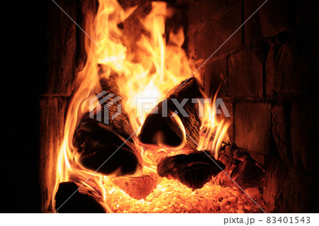 A Fire Is Burning In A Brick Village Stove. Flames, Hot Coals and Logs. A Fire Is Burning In A Brick Village Stove. Flames, Hot Coals and Logs. 83401543