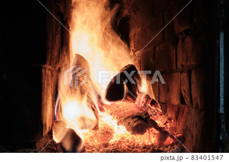 A Fire Is Burning In A Brick Village Stove. Flames, Hot Coals and Logs. A Fire Is Burning In A Brick Village Stove. Flames, Hot Coals and Logs. 83401547