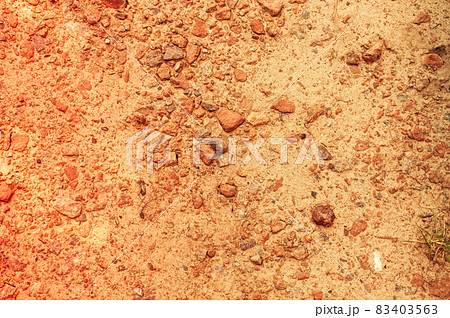 the metal cover of the sewer manhole is covered with sand. Warm toning and copy space the metal cover of the sewer manhole is covered with sand. Warm toning and copy space 83403563