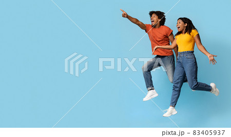 Thrilled african american couple looking at copy space Thrilled african american couple looking at copy space 83405937
