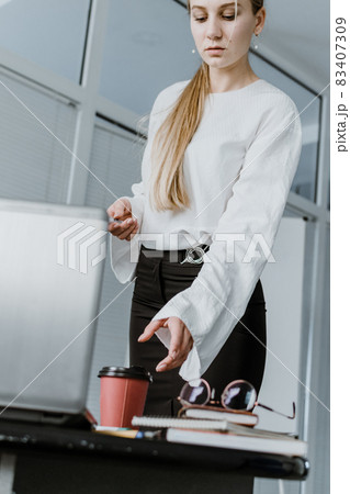 Young business woman, speaker coach drawing on white board and having online meeting in office. Focused team leader businesswoman, project manager working with white board 83407309