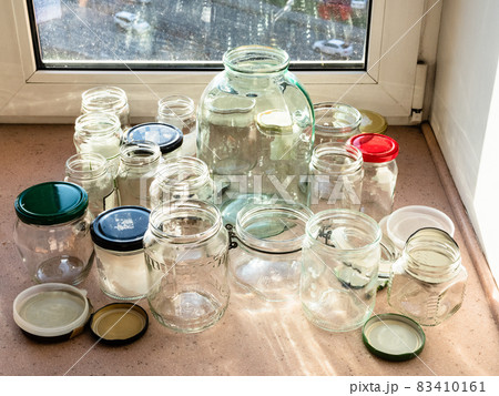various empty clean glass jars on window sill various empty clean glass jars on window sill 83410161
