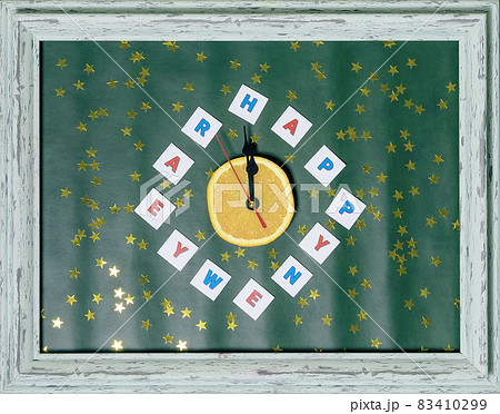 Congratulatory composition with an impromptu clock and Happy New Year greetings instead of numbers. Festive postcard. Flatlay image 83410299