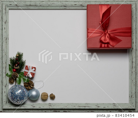 Christmas composition in an aged shabby frame. Festive paraphernalia. Flatlay image. Place to write 83410454