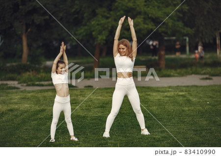 Sports family in a summer park Sports family in a summer park 83410990