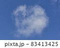 Background of a one single cumulus cloud with a blue clear sky 83413425