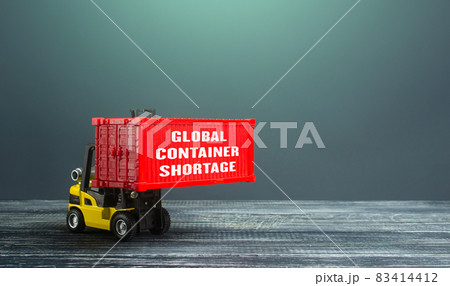 Global container shortage and a forklift. Problems of the international freight transport system. Imbalance, high prices for the transportation of goods. Consequences of economic slowdown. 83414412