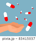 Pills falling into the hands with neutral blue background 83415037