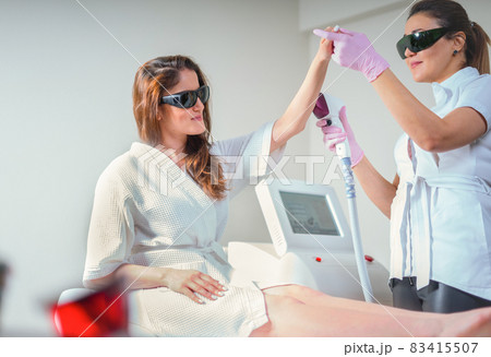 woman in professional beauty clinic during laser hair removal. Epilation Treatment. Smooth Skin concept woman in professional beauty clinic during laser hair removal. Epilation Treatment. Smooth Skin concept 83415507