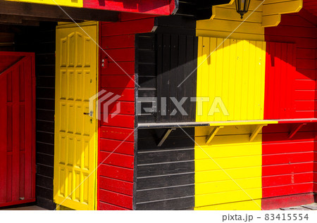 Wooden building with Belgium and Germany flag colors Wooden building with Belgium and Germany flag colors 83415554